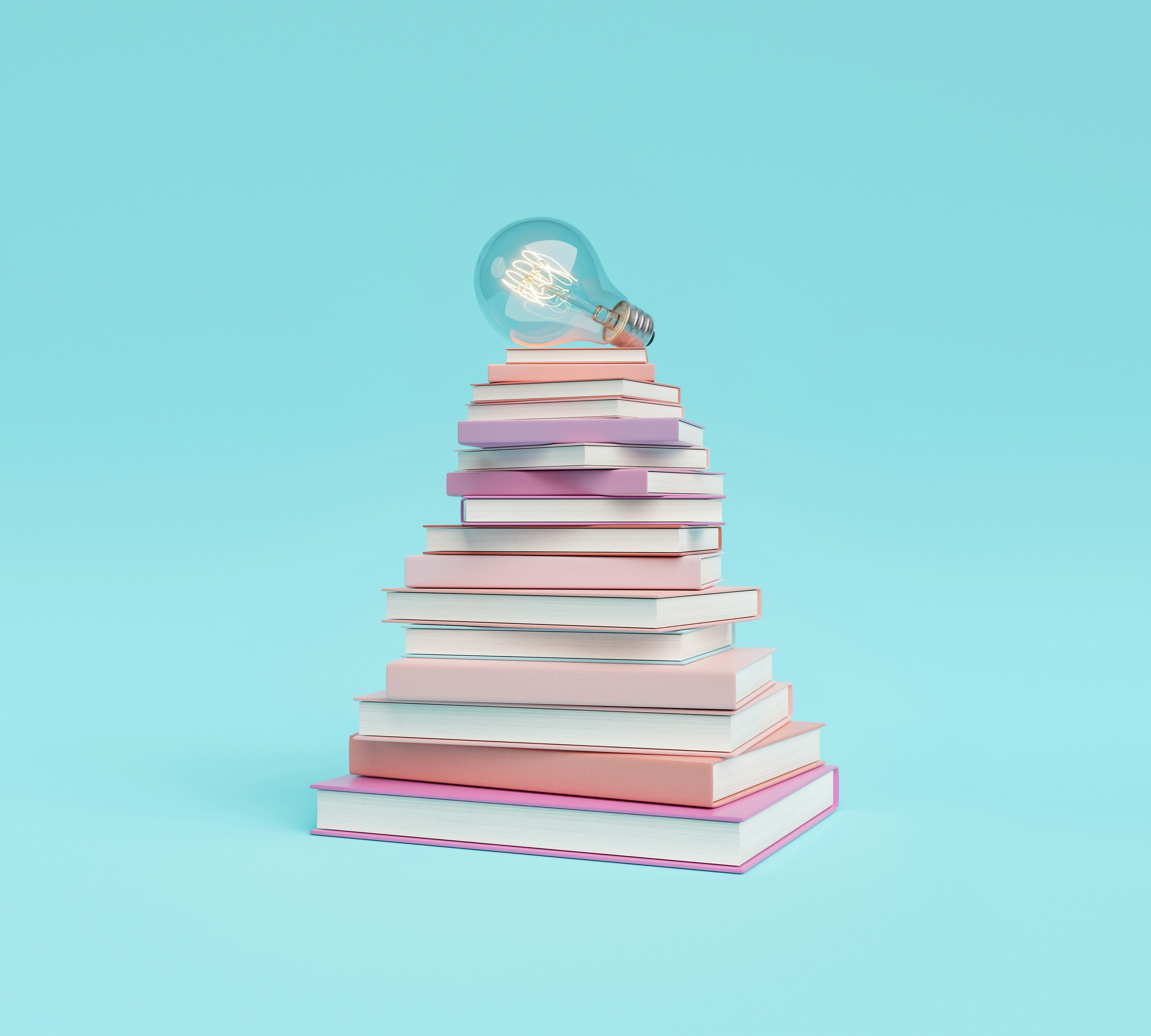 Stack of books with a lightbulb on top